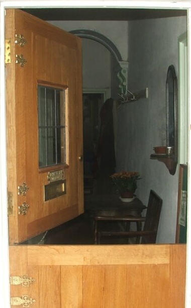 House Morgain. The front door opening to welcome you to a magical house